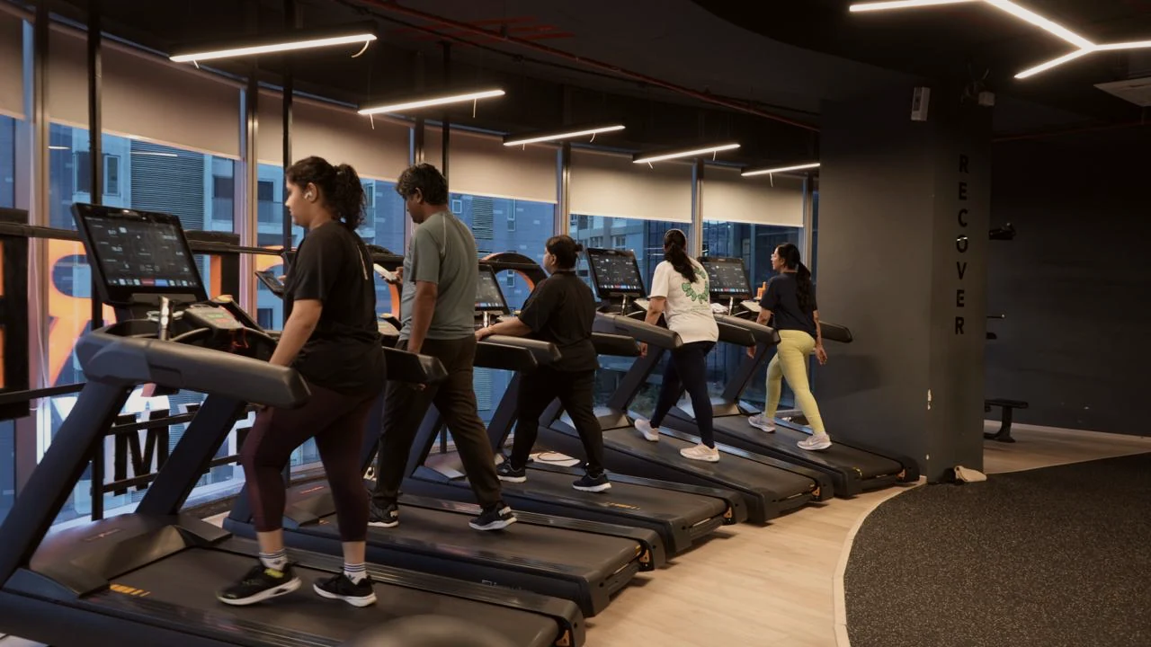 Members training on treadmills at COREO