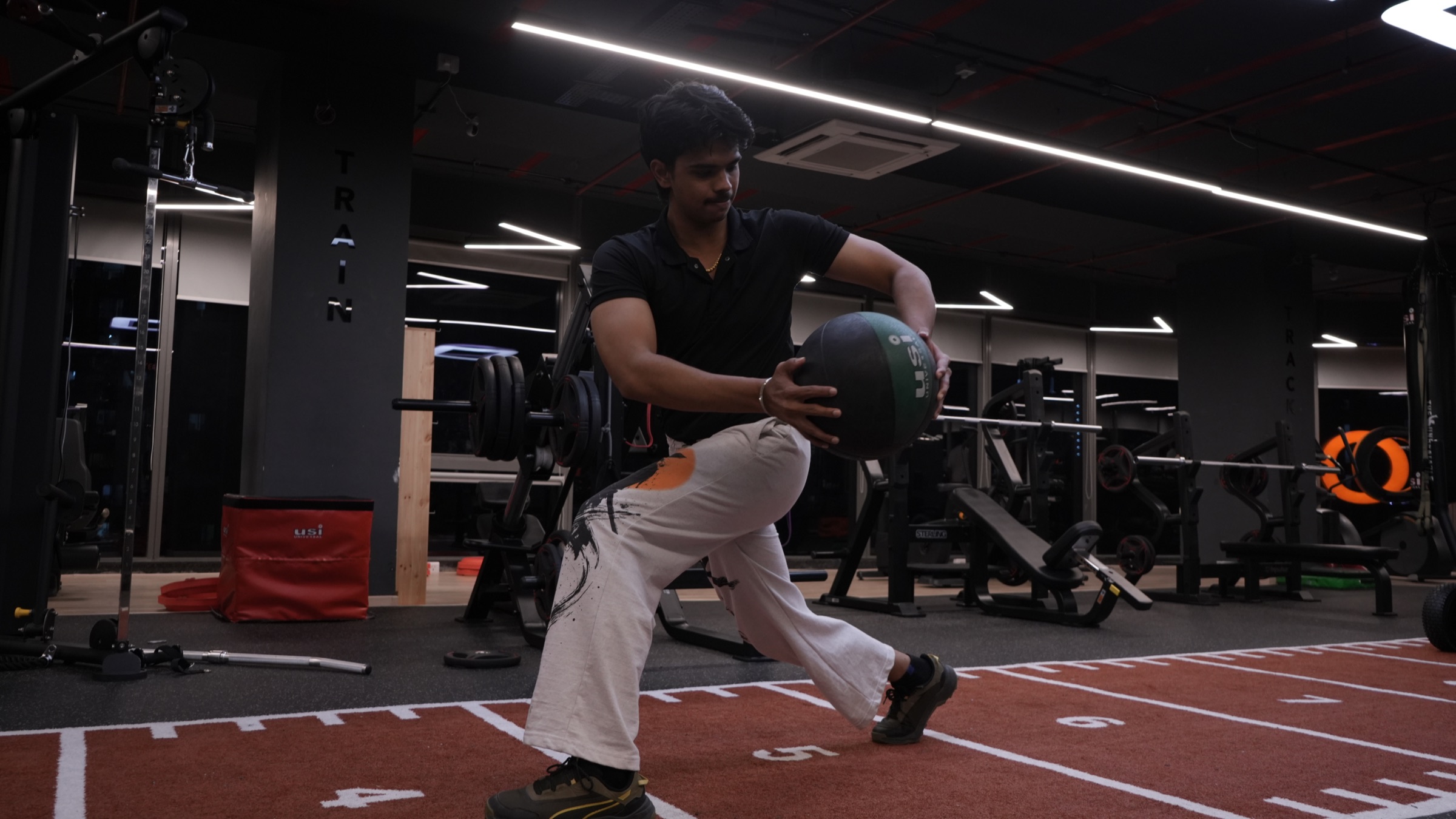 COREO member training with a medicine ball on the functional track