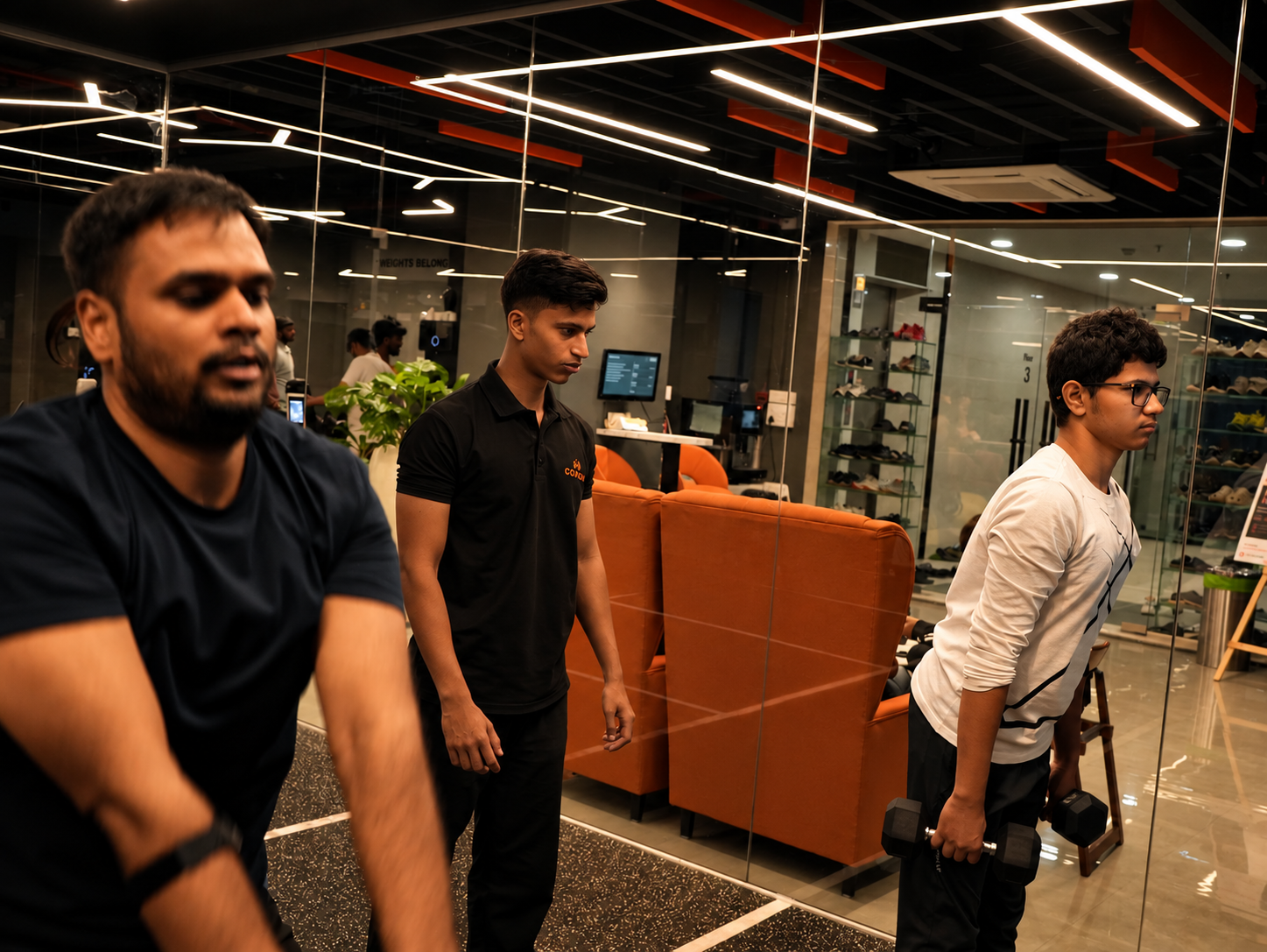 COREO coach and members gather between strength exercises